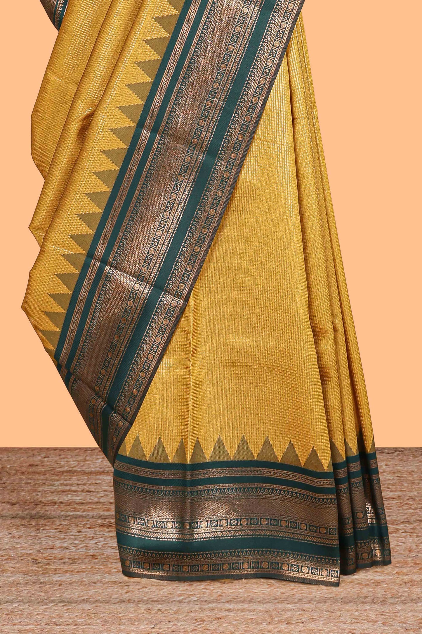 Mustard zari textured litchi silk saree with contrast zari border and floral motifs blouse