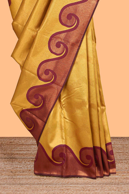 Yellow chevron zari design litchi silk saree with contrast swirl shape zari border and blouse