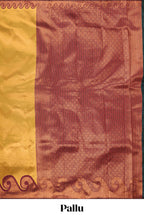 Yellow chevron zari design litchi silk saree with contrast swirl shape zari border and blouse