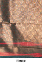 Yellow chevron zari design litchi silk saree with contrast swirl shape zari border and blouse