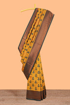 Mustard floral design zari motifs litchi silk saree with contrast zari border and blouse