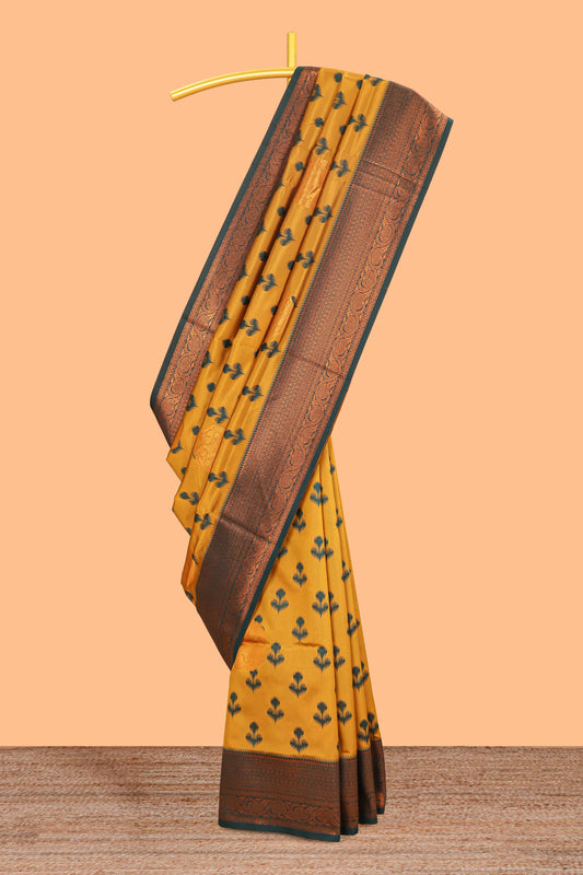 Mustard floral design zari motifs litchi silk saree with contrast zari border and blouse