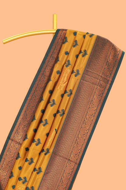 Mustard floral design zari motifs litchi silk saree with contrast zari border and blouse