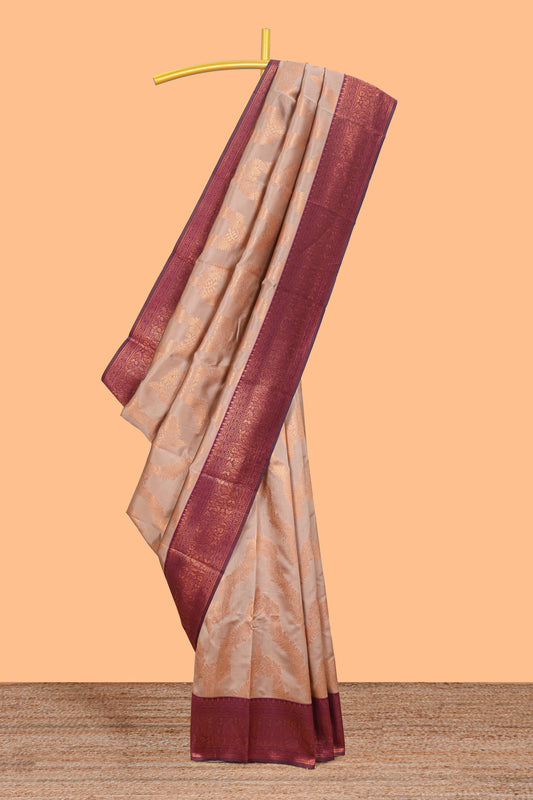 Beige chevron zari design litchi silk saree with contrast zari design border and contrast blouse