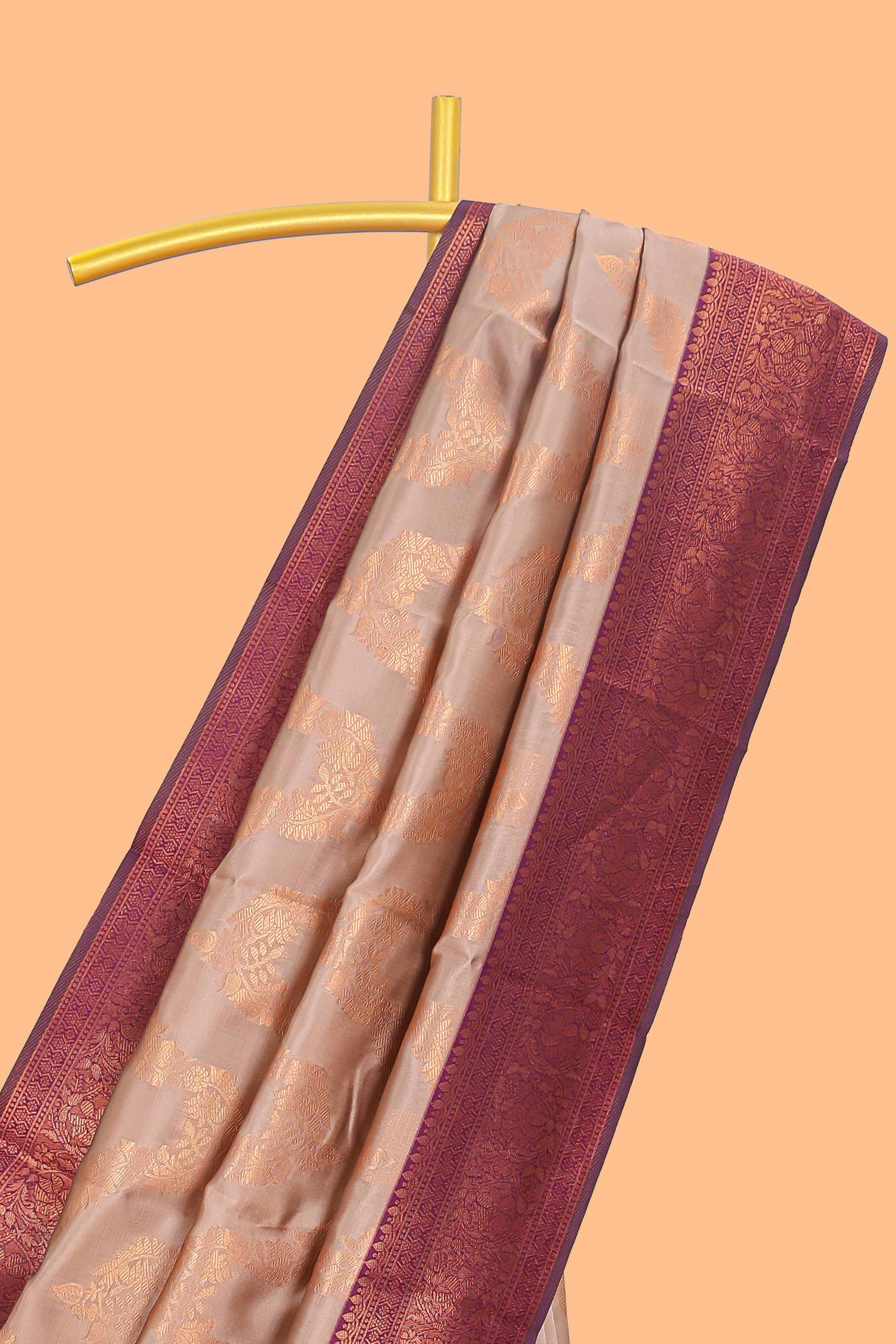 Beige chevron zari design litchi silk saree with contrast zari design border and contrast blouse