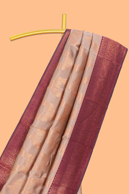 Beige chevron zari design litchi silk saree with contrast zari design border and contrast blouse