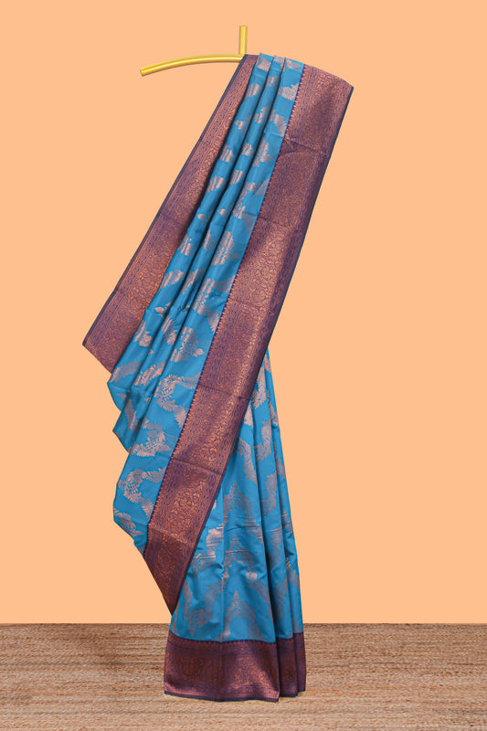 Blue chevron zari design litchi silk saree with contrast zari design border and contrast blouse