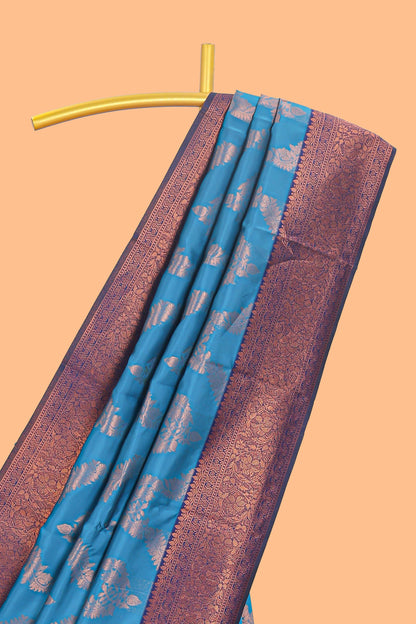 Blue chevron zari design litchi silk saree with contrast zari design border and contrast blouse