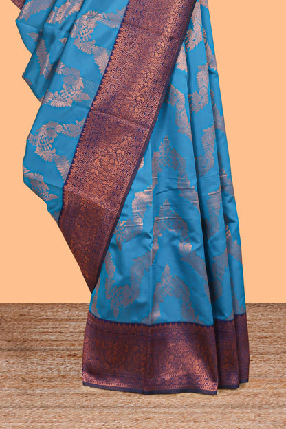 Blue chevron zari design litchi silk saree with contrast zari design border and contrast blouse