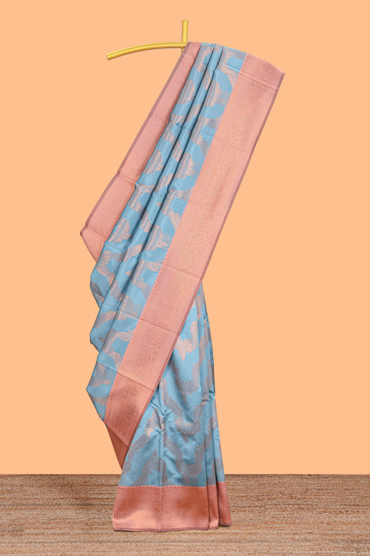 Sky blue chevron zari design litchi silk saree with contrast zari design border and contrast blouse