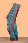 Jade green chevron zari design litchi silk saree with contrast zari design border and contrast blouse