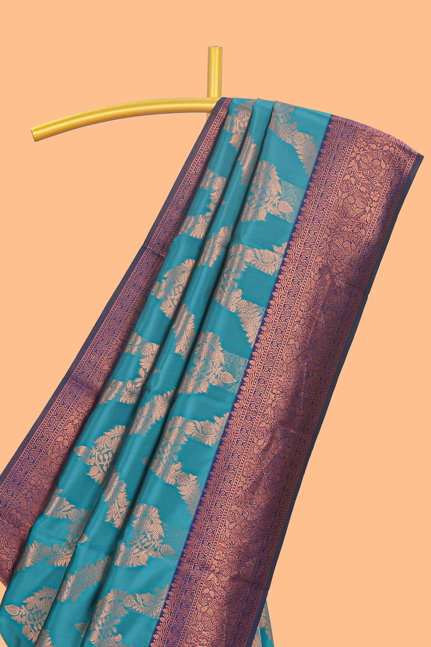 Jade green chevron zari design litchi silk saree with contrast zari design border and contrast blouse
