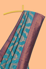 Jade green chevron zari design litchi silk saree with contrast zari design border and contrast blouse