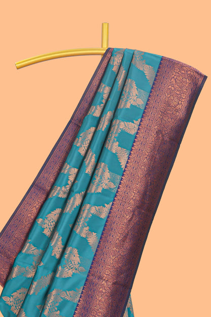 Jade green chevron zari design litchi silk saree with contrast zari design border and contrast blouse