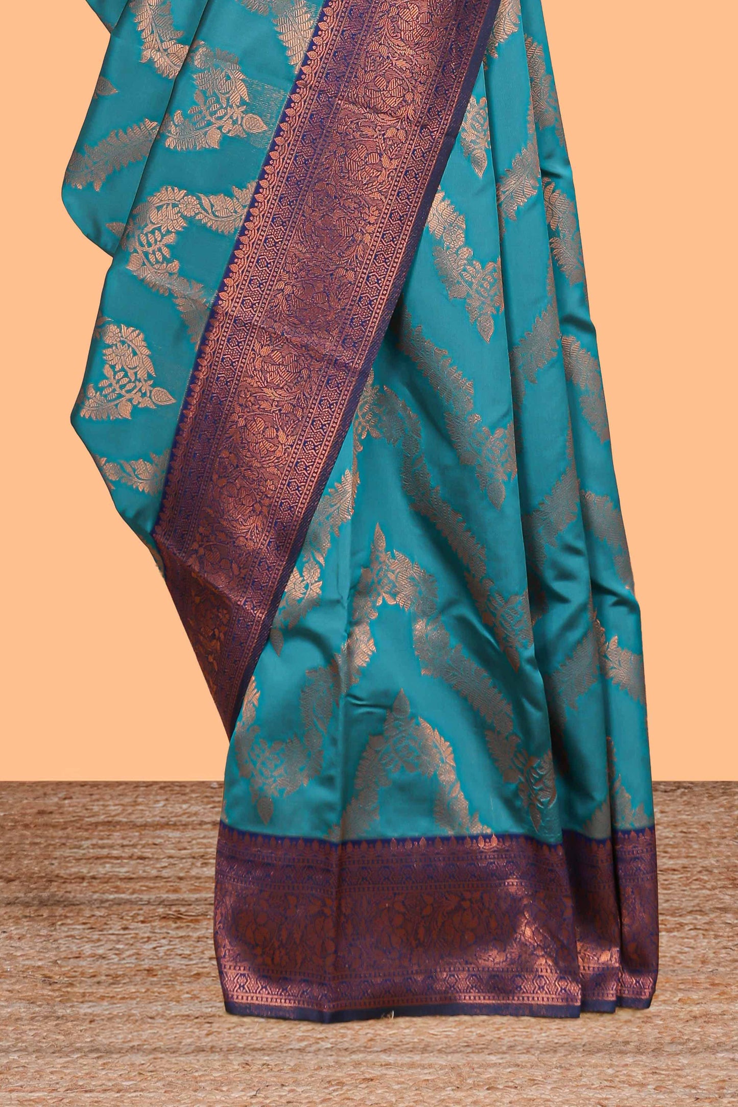Jade green chevron zari design litchi silk saree with contrast zari design border and contrast blouse