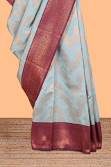 Baby blue chevron zari design litchi silk saree with contrast zari design border and contrast blouse
