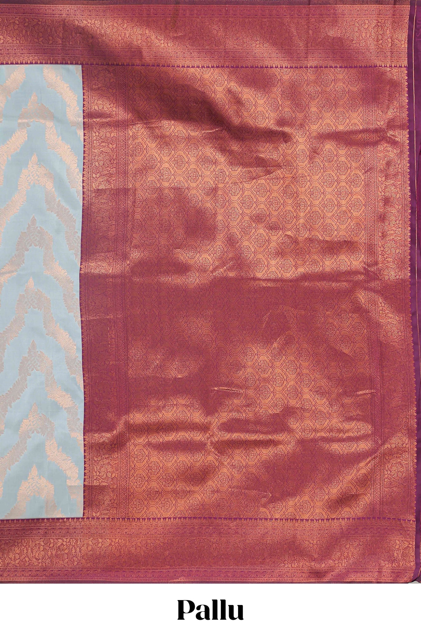 Baby blue chevron zari design litchi silk saree with contrast zari design border and contrast blouse