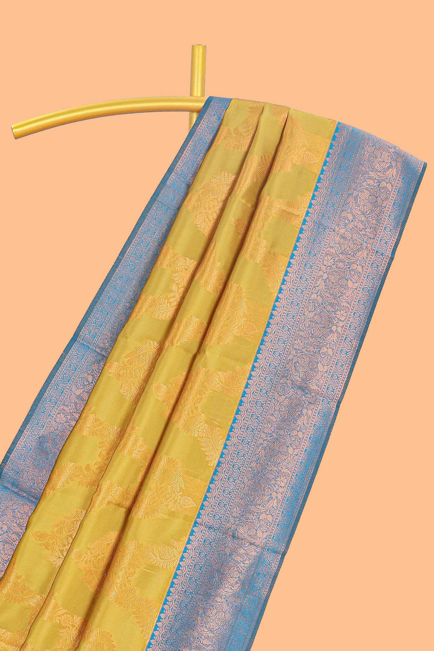 Mustard chevron zari design litchi silk saree with contrast zari design border and contrast blouse