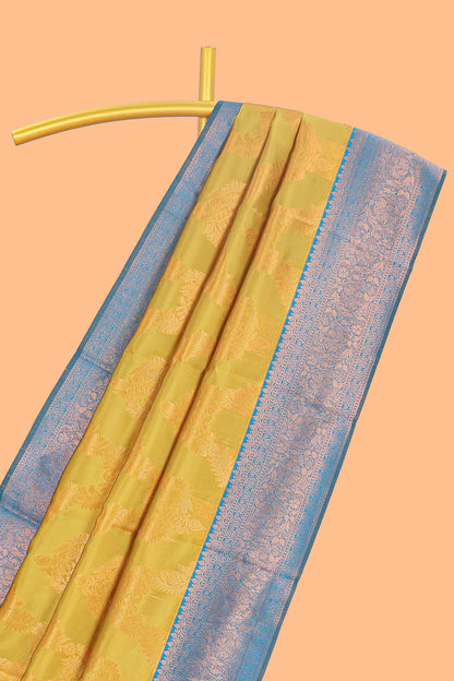 Mustard chevron zari design litchi silk saree with contrast zari design border and contrast blouse