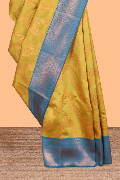 Mustard chevron zari design litchi silk saree with contrast zari design border and contrast blouse