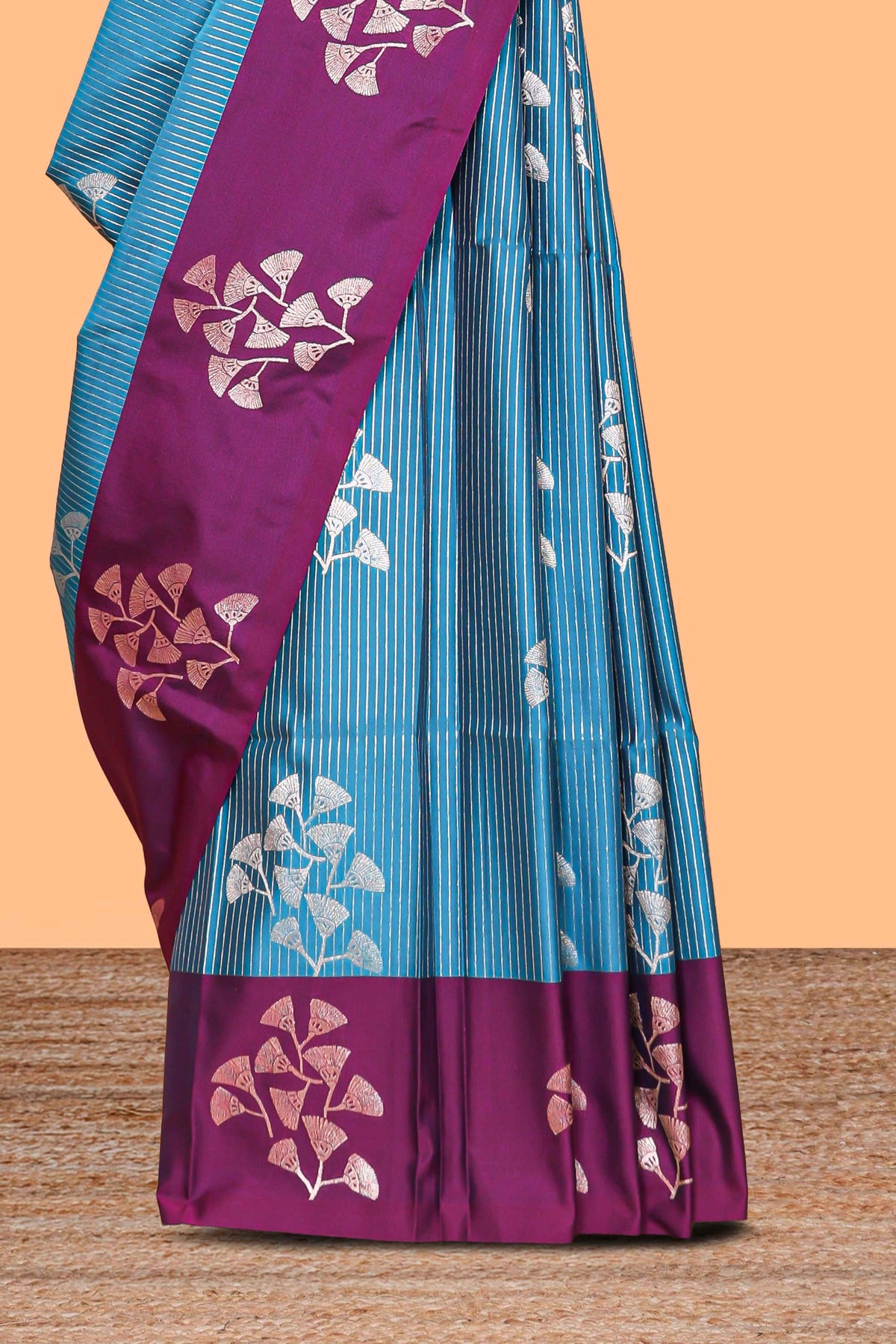 Blue striped floral zari design litchi silk saree with contrast zari design border and plain blouse
