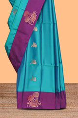Ocean blue zari motifs design litchi silk saree with contrast zari design border and plain blouse