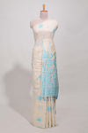 Powder blue floral printmunga cotton sareewith matching floral print pallu along with tassles