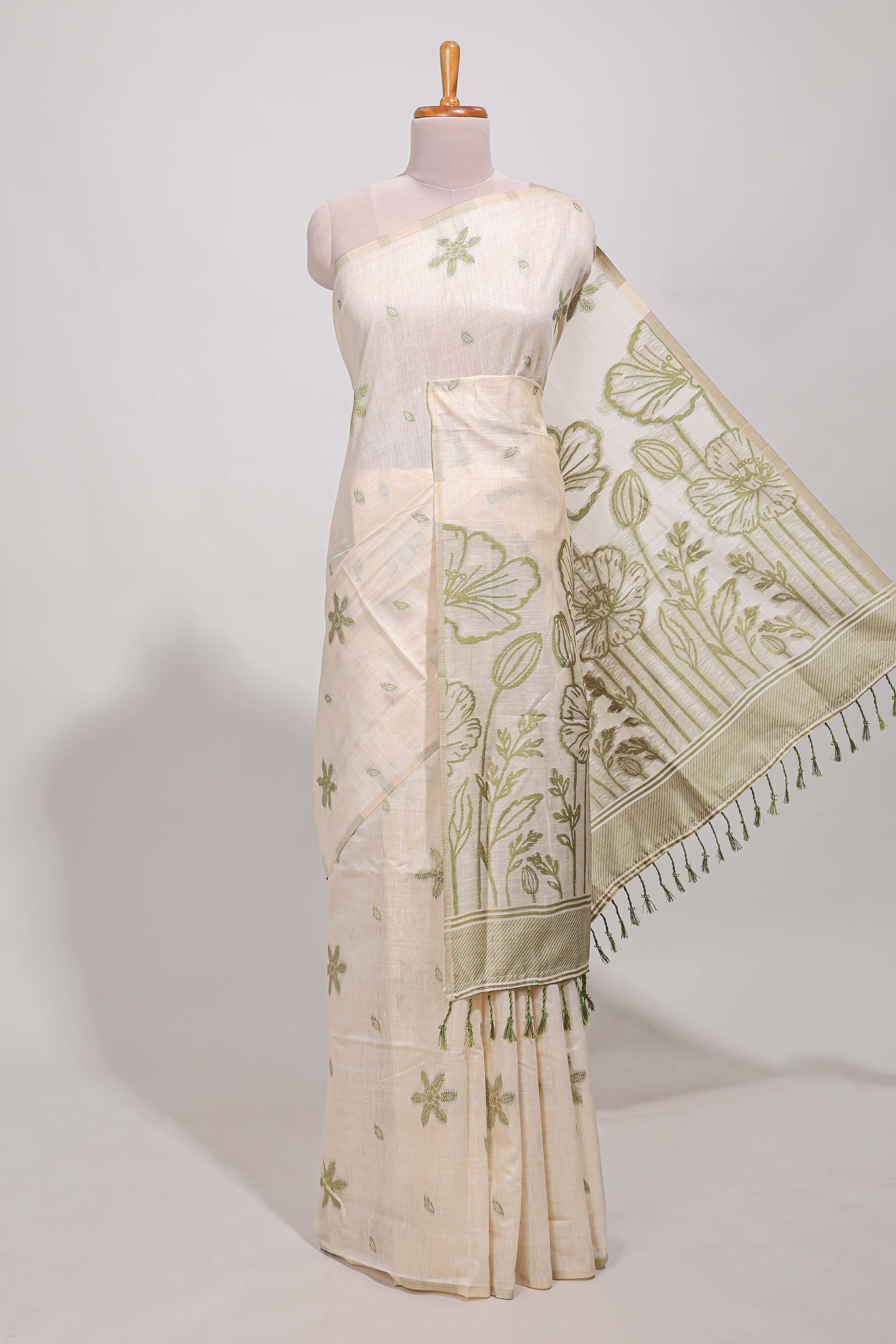 Pastel green floral printmunga cotton sareewith matching floral print pallu along with tassles