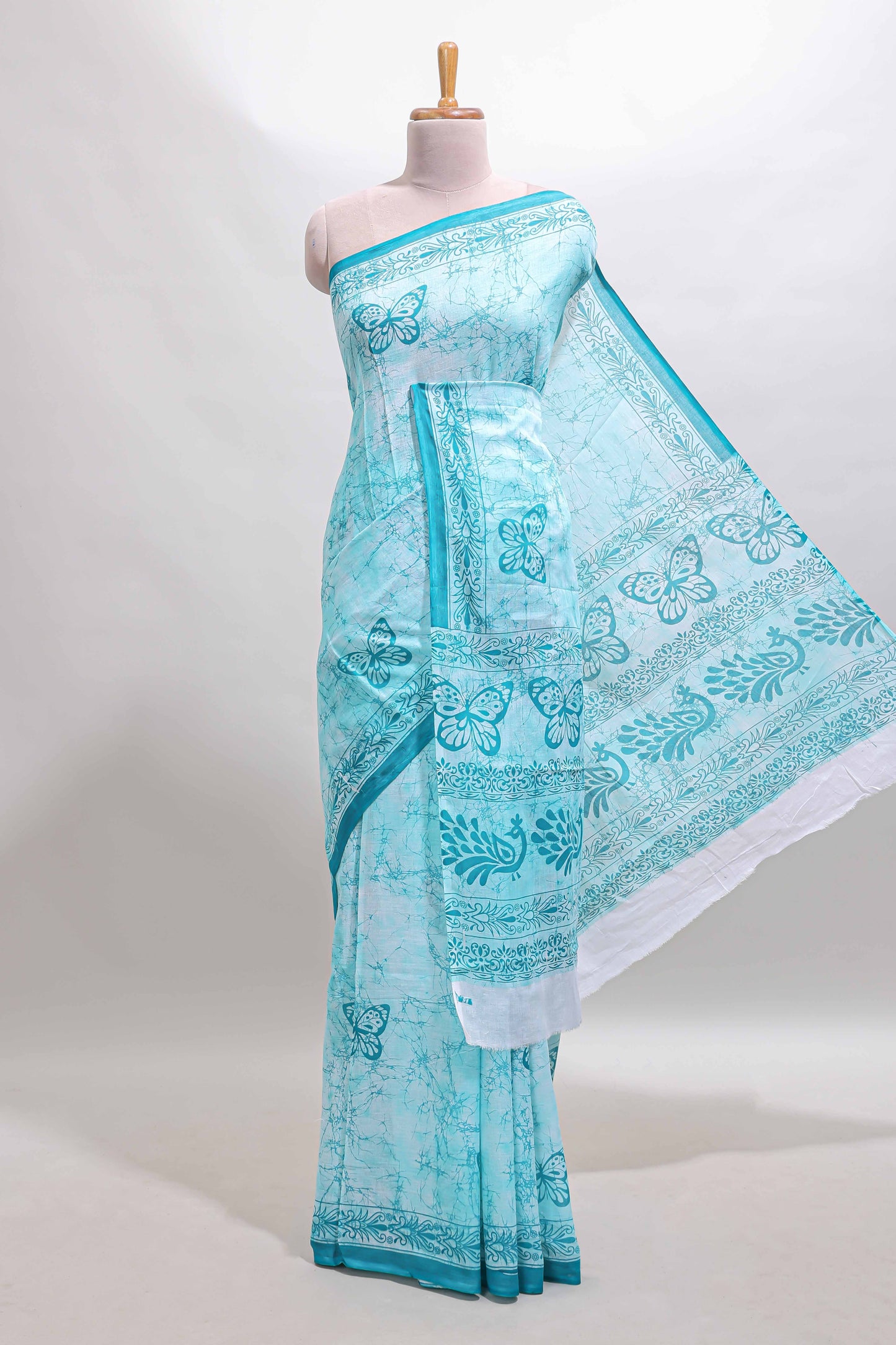 Turquoise green butterfly motifs design mul mul cotton saree with self border and matching warli print blouse
