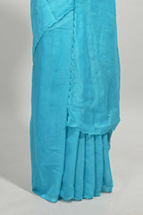 Blue mirror work embroidery design mul mul cotton saree with self scallop border and contrast multi color blouse