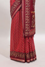 Maroon chevron print marsh mellow saree with contrast zari border and contrast blouse