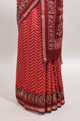 Red chevron print marsh mellow saree with contrast zari border and contrast blouse