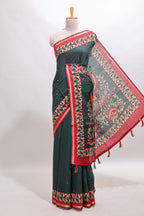 Green marsh mellow saree featuring mirror embroidery, contrast floral printed border & blouse