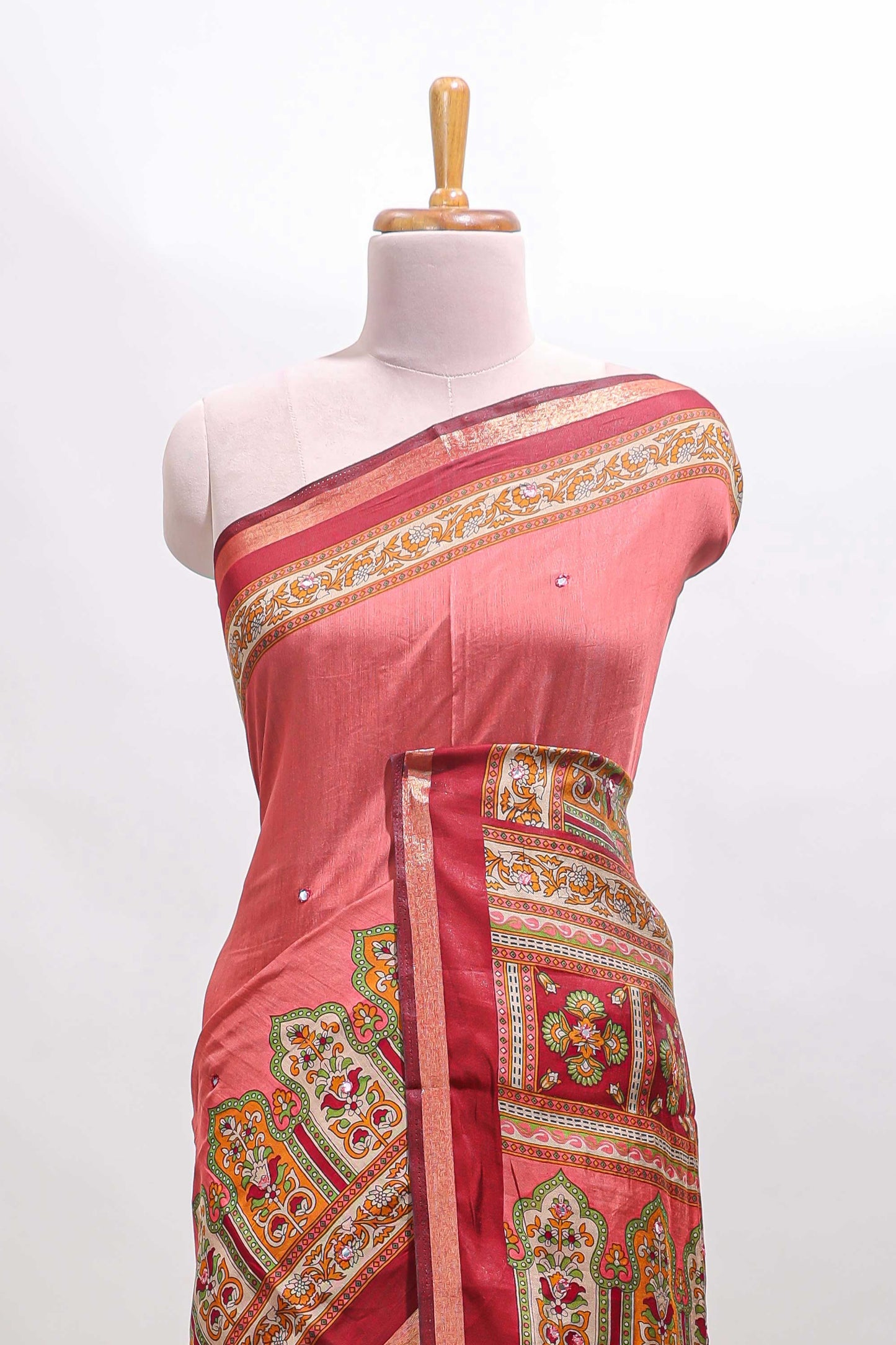 Peach printed marsh mellow saree with contrast floral border and tassel pallu