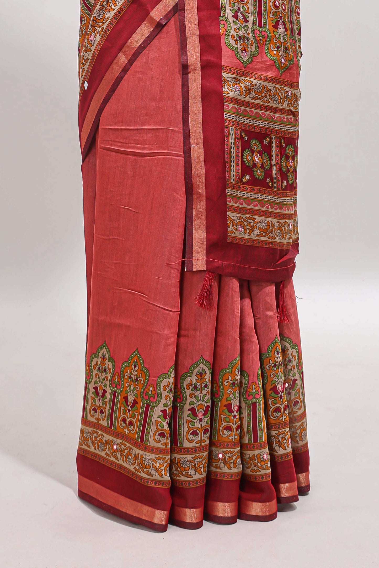 Peach printed marsh mellow saree with contrast floral border and tassel pallu
