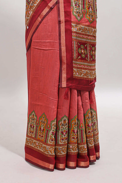 Peach printed marsh mellow saree with contrast floral border and tassel pallu