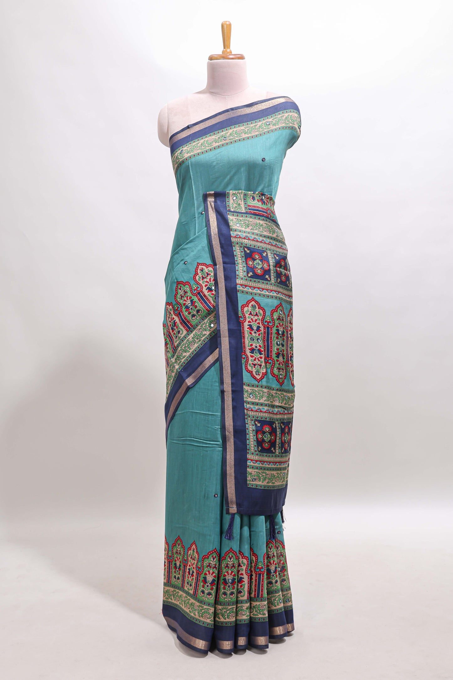 Blue printed marsh mellow saree with contrast floral border and tassel pallu
