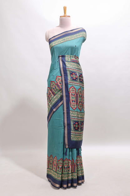 Blue printed marsh mellow saree with contrast floral border and tassel pallu