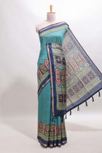 Blue printed marsh mellow saree with contrast floral border and tassel pallu