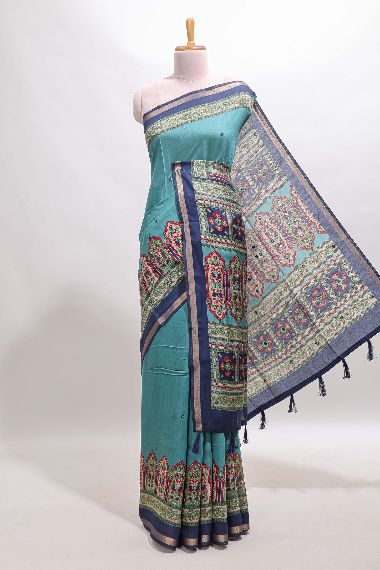 Blue printed marsh mellow saree with contrast floral border and tassel pallu
