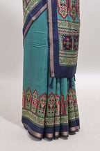 Blue printed marsh mellow saree with contrast floral border and tassel pallu