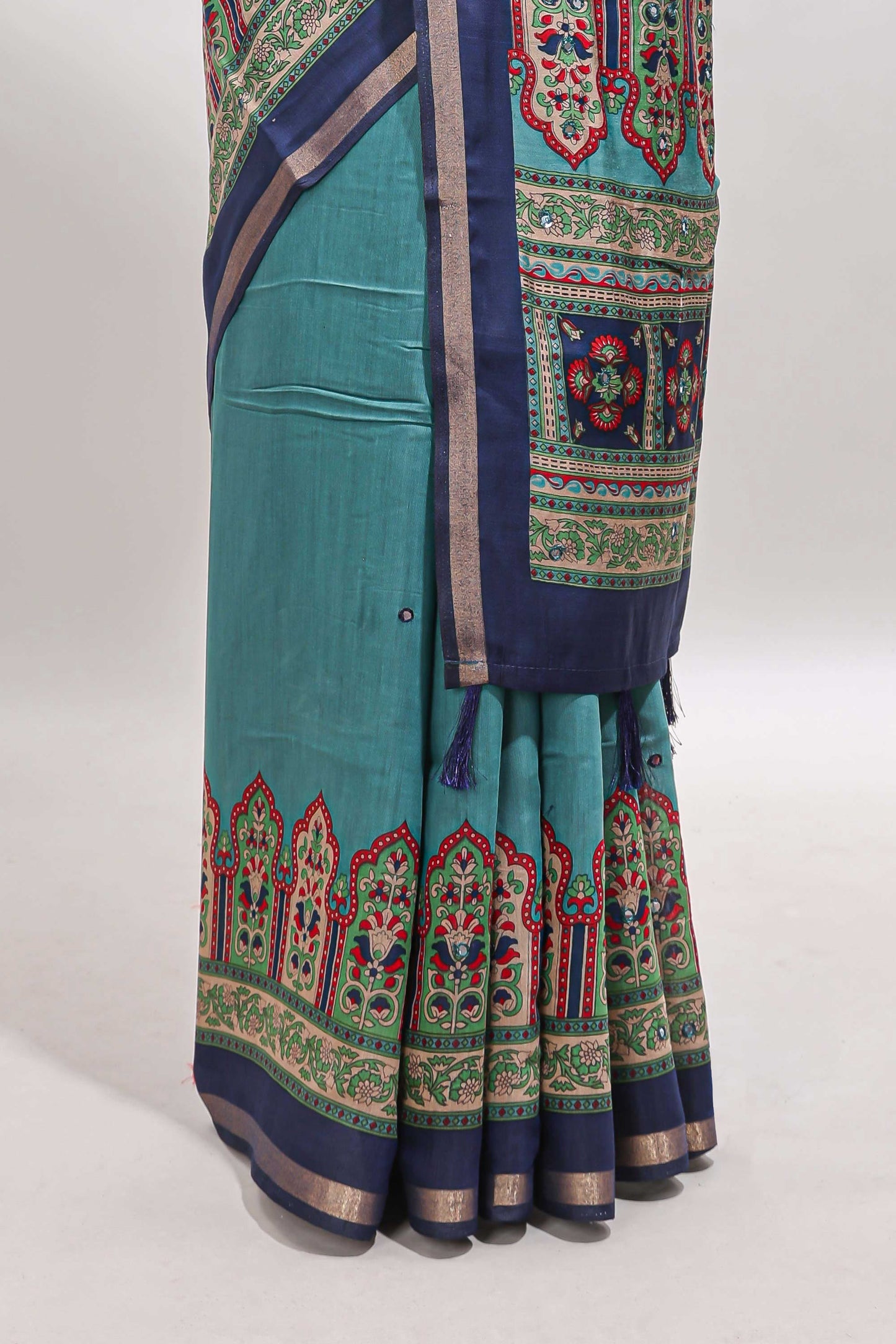 Blue printed marsh mellow saree with contrast floral border and tassel pallu