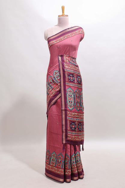 Peach printed marsh mellow saree with contrast floral border and tassel pallu