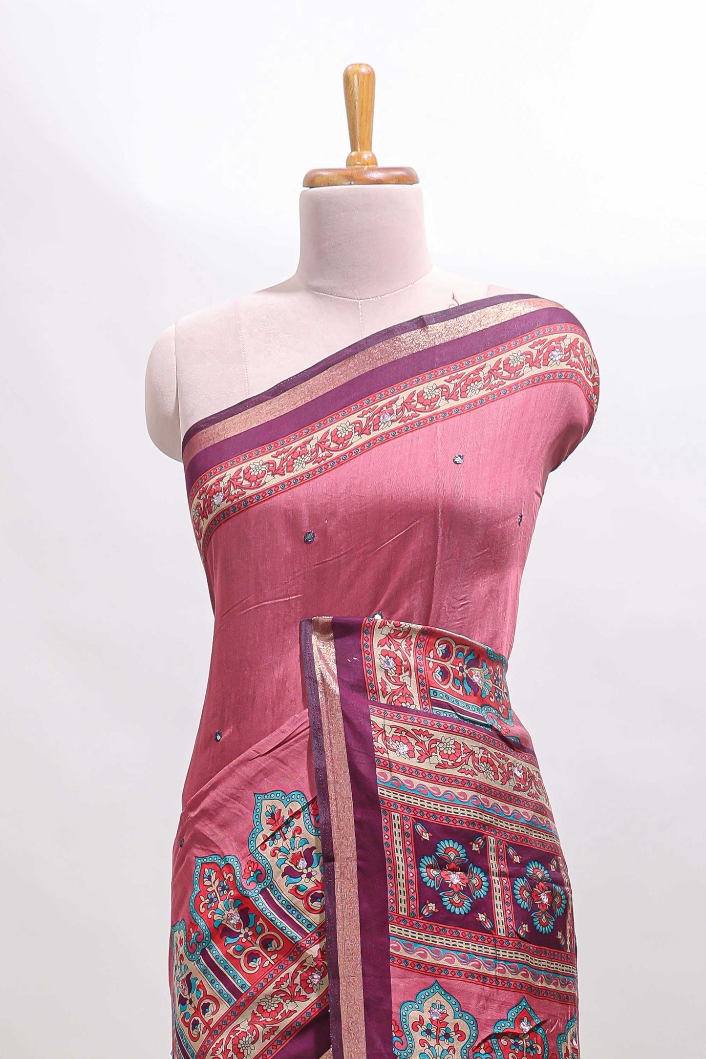 Peach printed marsh mellow saree with contrast floral border and tassel pallu