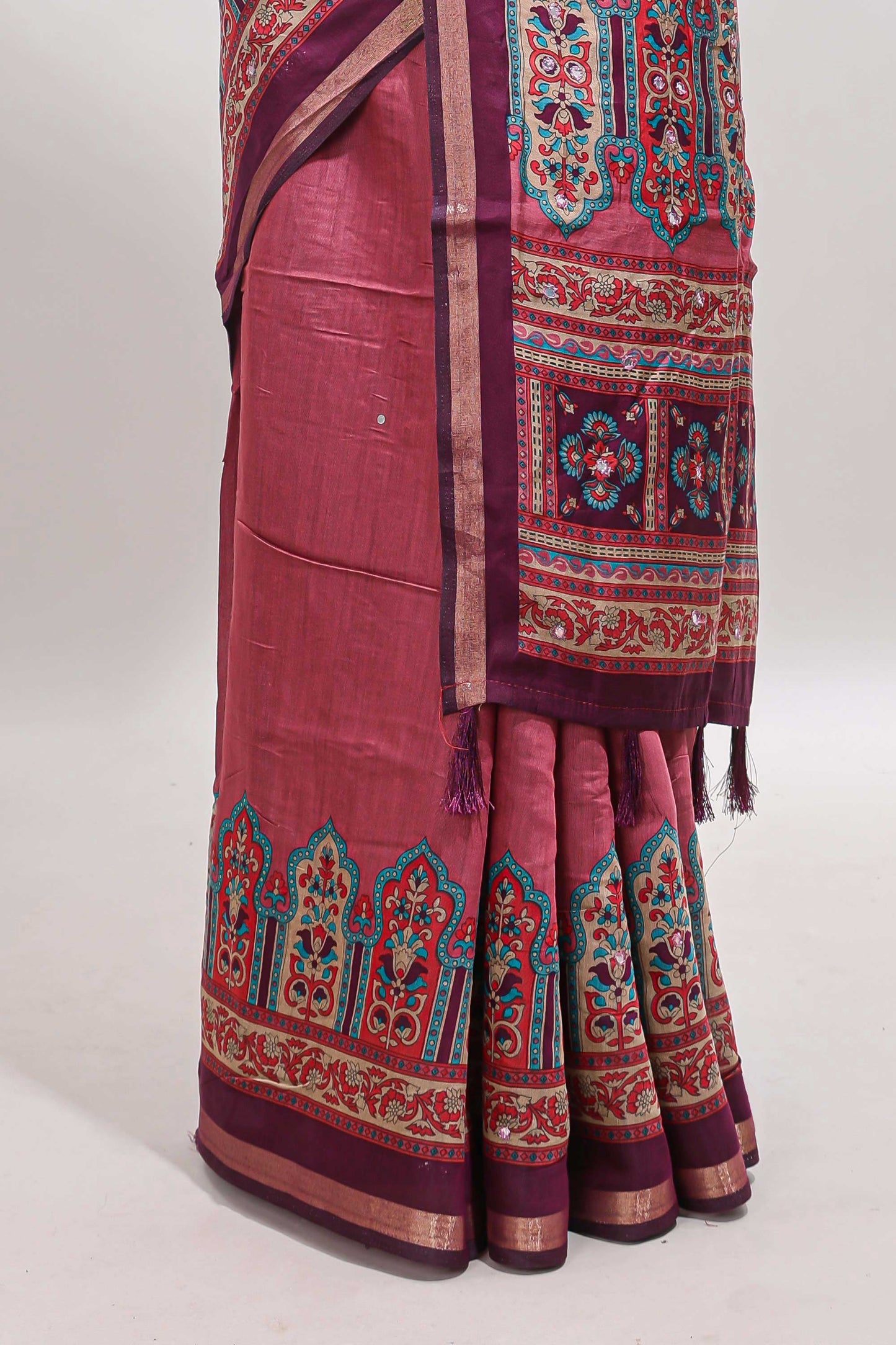 Peach printed marsh mellow saree with contrast floral border and tassel pallu