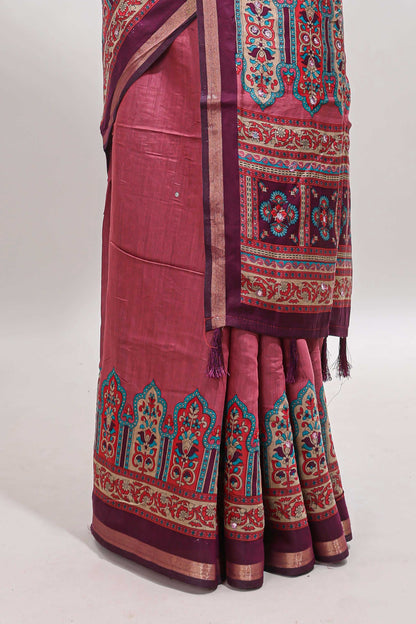 Peach printed marsh mellow saree with contrast floral border and tassel pallu