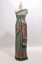 Green printed marsh mellow saree with contrast floral border and tassel pallu