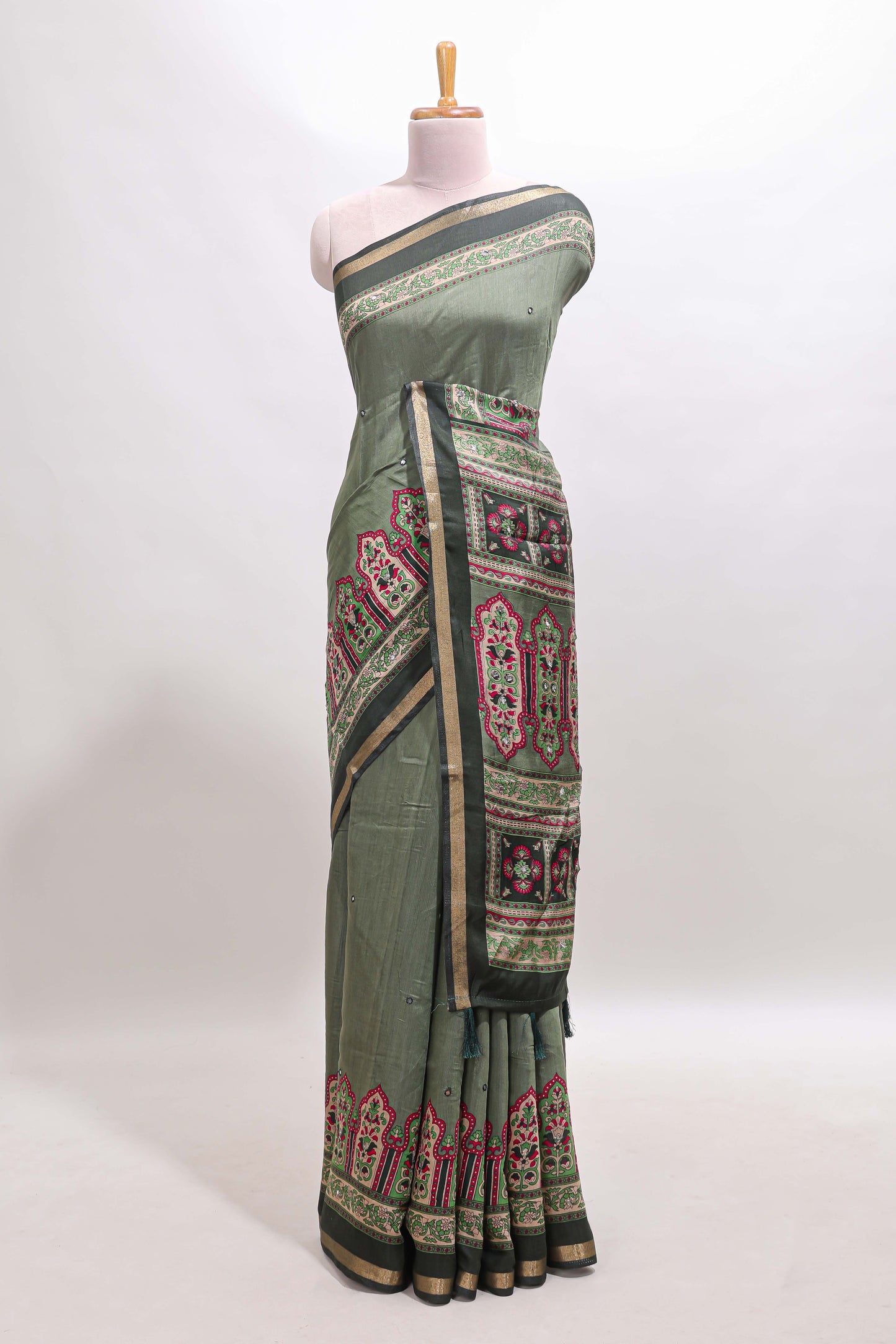 Green printed marsh mellow saree with contrast floral border and tassel pallu