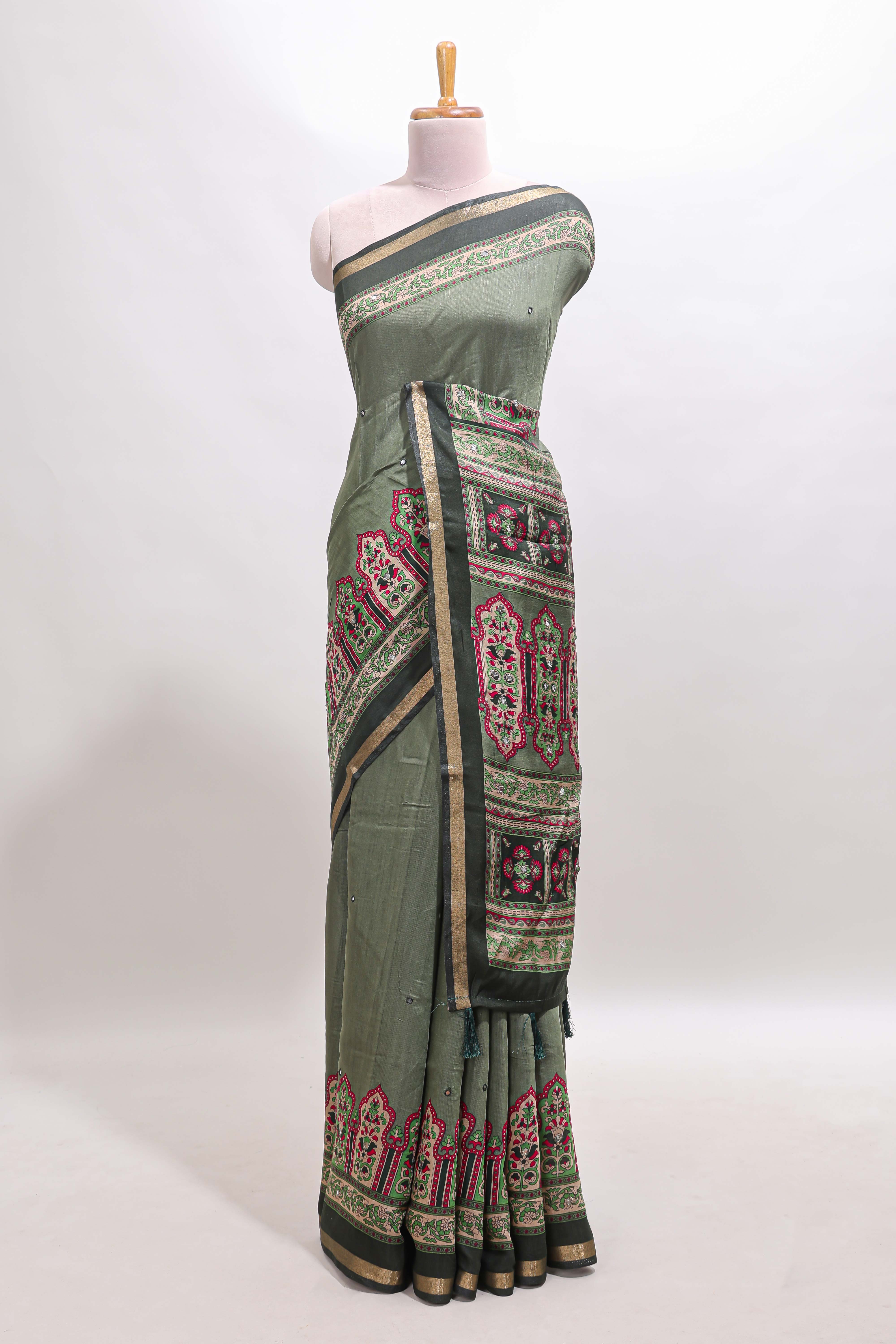 Green printed marsh mellow saree with contrast floral border and tassel pallu
