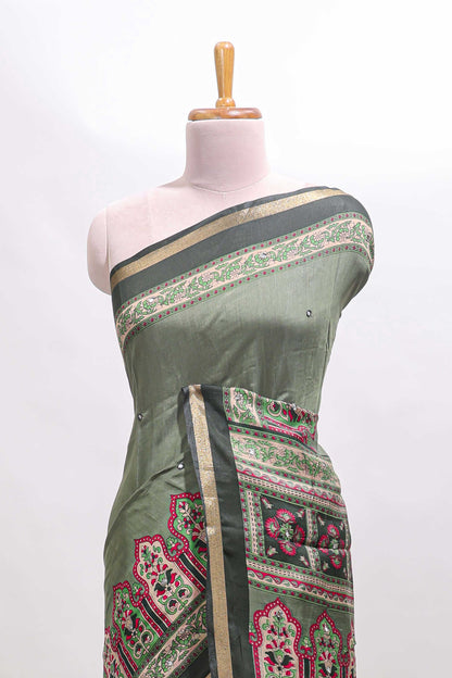 Green printed marsh mellow saree with contrast floral border and tassel pallu